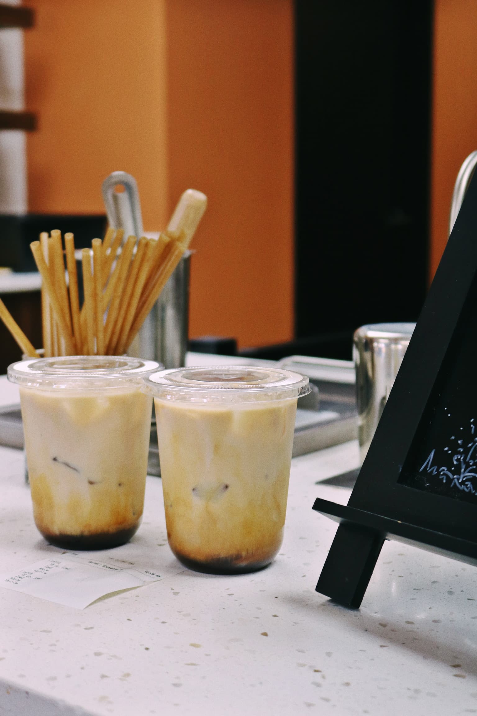 Two iced lattes on the counter at Revival Coffee